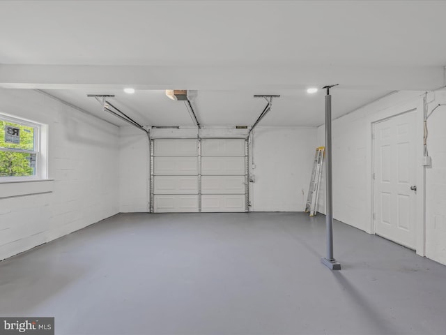 garage with concrete block wall