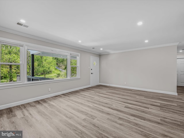 unfurnished living room with baseboards, ornamental molding, recessed lighting, and visible vents
