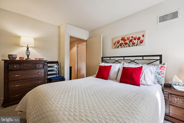 carpeted bedroom with visible vents
