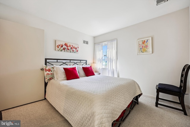 bedroom featuring carpet floors, baseboards, and visible vents