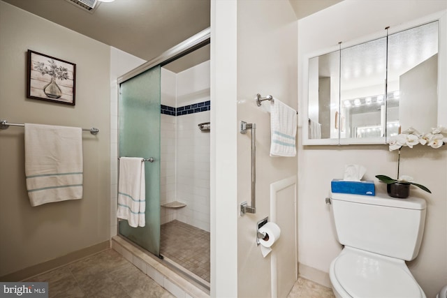 full bath with visible vents, a stall shower, baseboards, tile patterned floors, and toilet