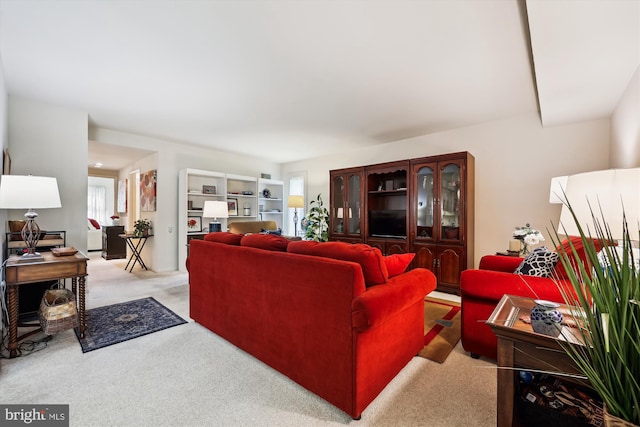 living area featuring carpet floors