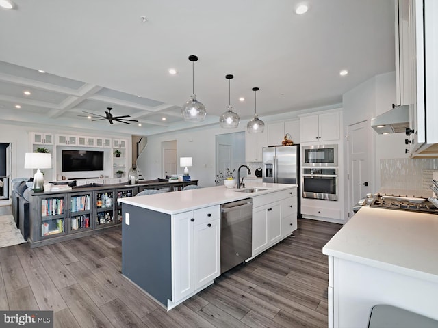 9929 Pesade Way, Upper Marlboro, MD 20772 - kitchen featuring appliances with stainless steel finishes, a sink, open floor plan, wood finished floors, and recessed lighting