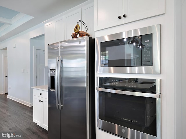 9929 Pesade Way, Upper Marlboro, MD 20772 - kitchen featuring stainless steel appliances, dark wood-style floors, white cabinetry, and baseboards