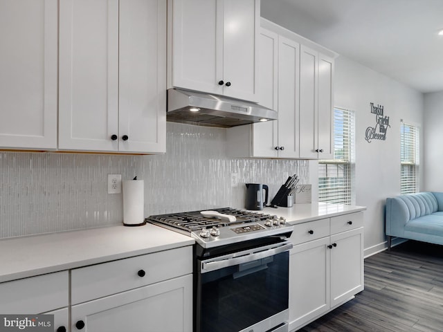 9929 Pesade Way, Upper Marlboro, MD 20772 - kitchen with stainless steel gas range, under cabinet range hood, white cabinetry, backsplash, and light countertops