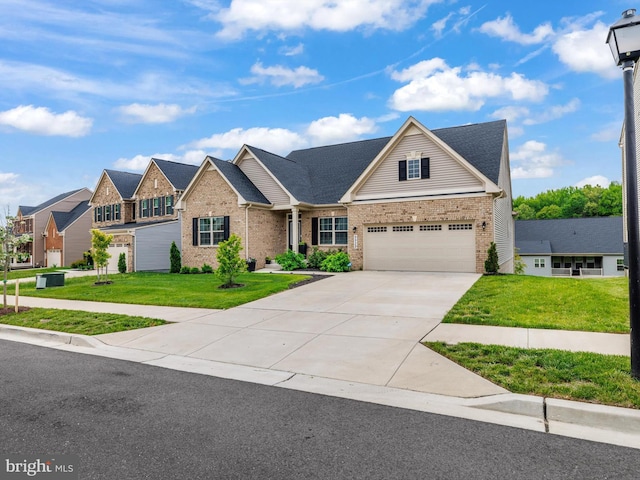 9929 Pesade Way, Upper Marlboro, MD 20772 - view of front of property featuring brick siding, a front yard, concrete driveway, and a residential view