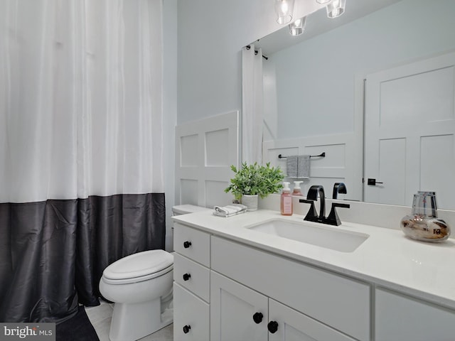 9929 Pesade Way, Upper Marlboro, MD 20772 - full bath with a decorative wall, toilet, vanity, wainscoting, and curtained shower