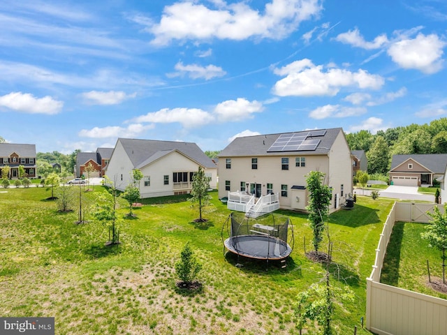 9929 Pesade Way, Upper Marlboro, MD 20772 - rear view of property with a trampoline, solar panels, and a residential view