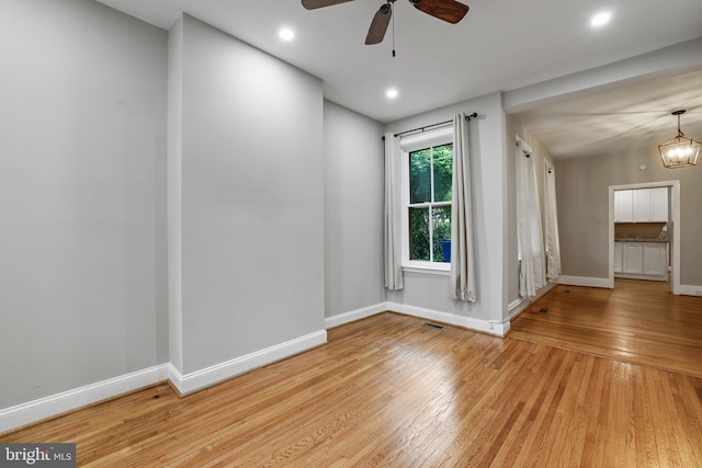 304 W S St, Frederick, MD 21701 - unfurnished room with light wood-type flooring, baseboards, a ceiling fan, a chandelier, and recessed lighting