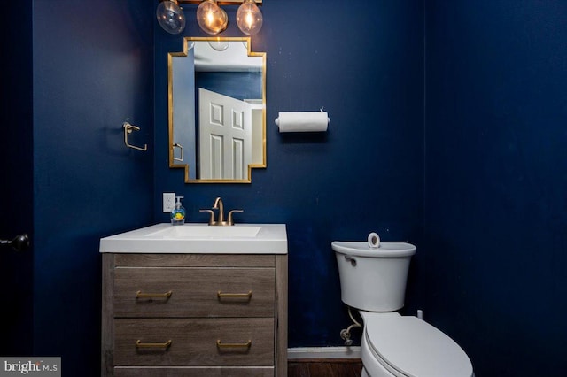 102 Haldane Dr, La Plata, MD 20646 - bathroom with toilet, vanity, baseboards, and wood finished floors