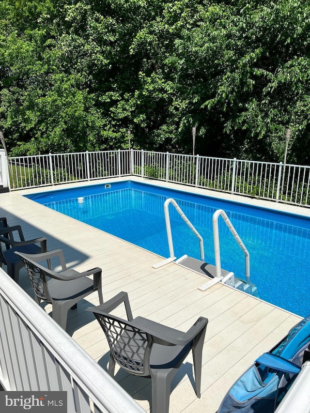 102 Haldane Dr, La Plata, MD 20646 - view of pool featuring fence and a wooden deck