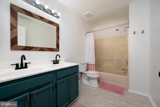 102 Haldane Dr, La Plata, MD 20646 - bathroom with double vanity, toilet, shower / bath combo with shower curtain, and baseboards