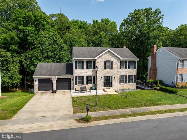 102 Haldane Dr, La Plata, MD 20646 - colonial-style house featuring an attached garage, a front lawn, concrete driveway, and stone siding