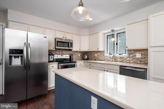 102 Haldane Dr, La Plata, MD 20646 - kitchen with appliances with stainless steel finishes, hanging light fixtures, and decorative backsplash
