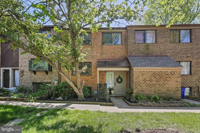 townhome / multi-family property with brick siding