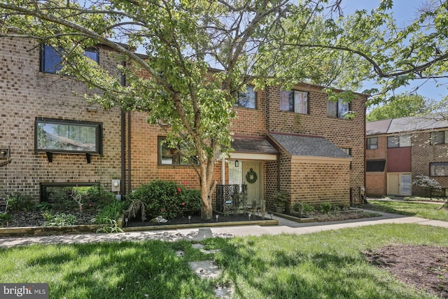 view of front of home with brick siding