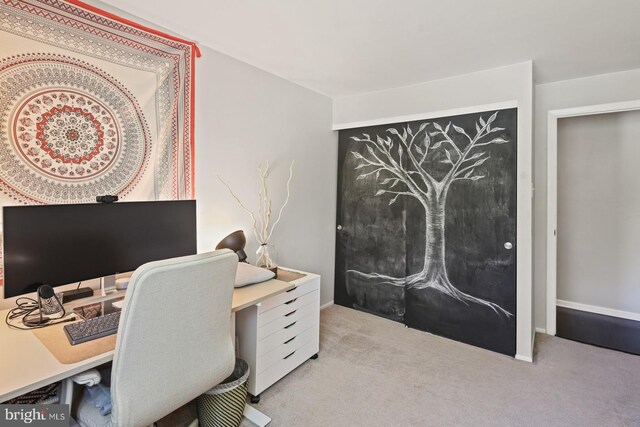 home office featuring carpet floors and baseboards