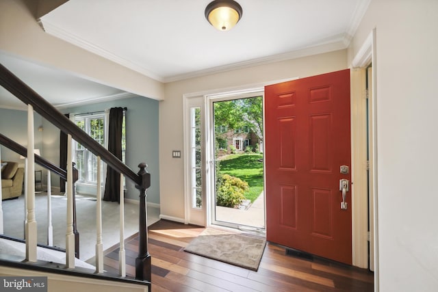 entrance foyer featuring plenty of natural light, wood-type flooring, and stairs