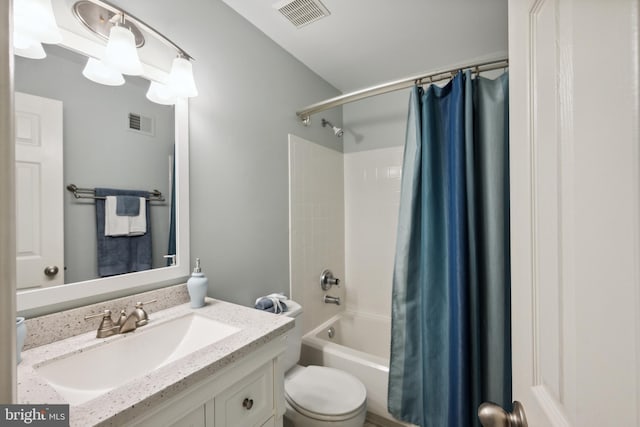 full bath featuring vanity, shower / tub combo with curtain, toilet, and visible vents