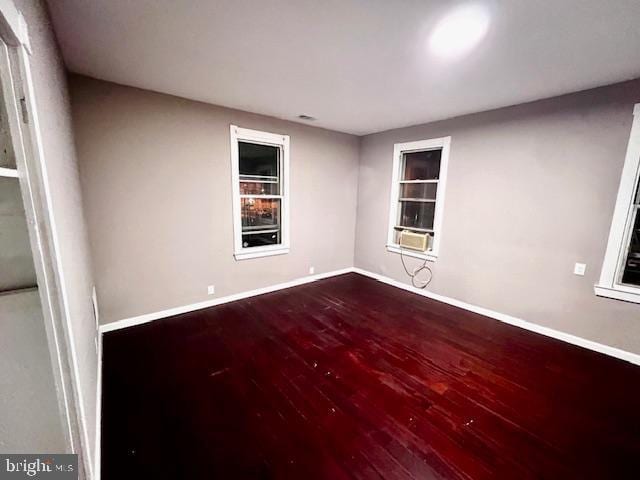 218 Cooper St, Beverly, NJ 08010 - unfurnished room with baseboards, cooling unit, and hardwood / wood-style floors