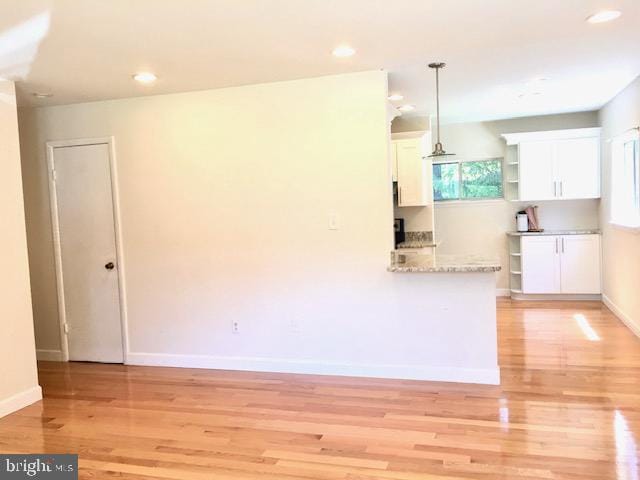 13211 Lutes Dr, Silver Spring, MD 20906 - kitchen featuring white cabinets, light wood-type flooring, recessed lighting, pendant lighting, and baseboards
