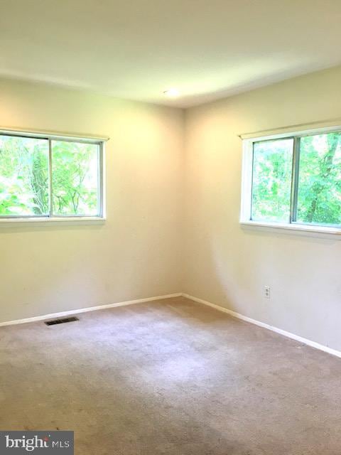 13211 Lutes Dr, Silver Spring, MD 20906 - spare room featuring baseboards and carpet flooring