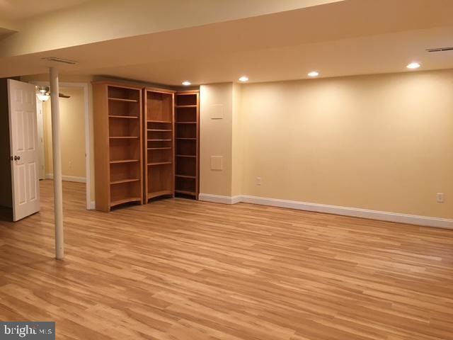 13211 Lutes Dr, Silver Spring, MD 20906 - finished below grade area with baseboards, light wood-style floors, and recessed lighting