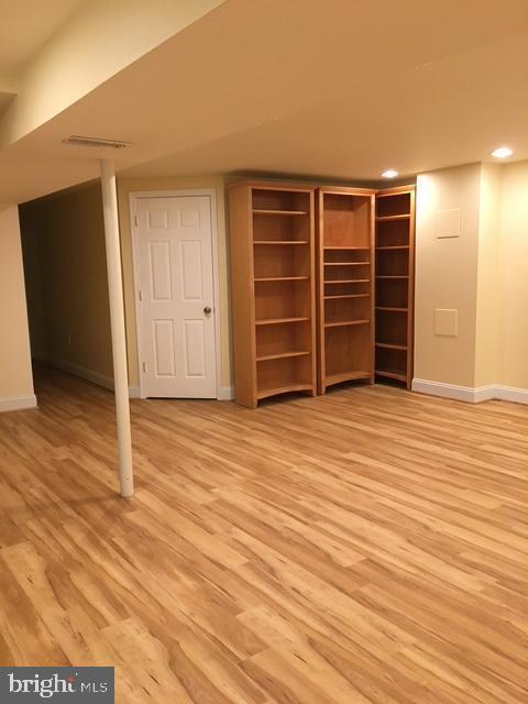 13211 Lutes Dr, Silver Spring, MD 20906 - unfurnished bedroom with baseboards, light wood finished floors, and recessed lighting