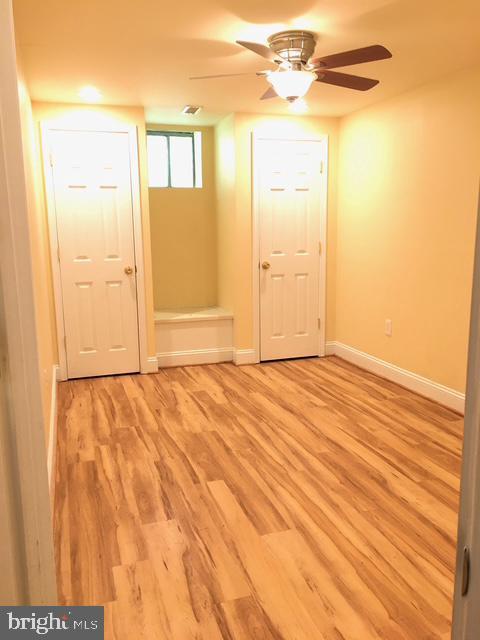13211 Lutes Dr, Silver Spring, MD 20906 - spare room featuring light wood-style floors, baseboards, and a ceiling fan