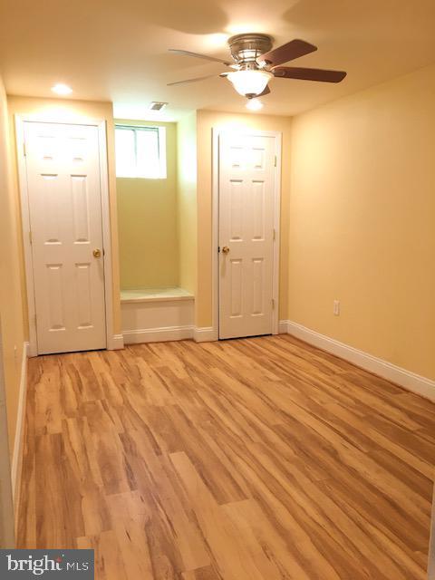 13211 Lutes Dr, Silver Spring, MD 20906 - foyer with ceiling fan, light wood-type flooring, and baseboards