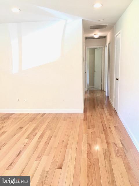 13211 Lutes Dr, Silver Spring, MD 20906 - corridor featuring light wood-style flooring, baseboards, and recessed lighting