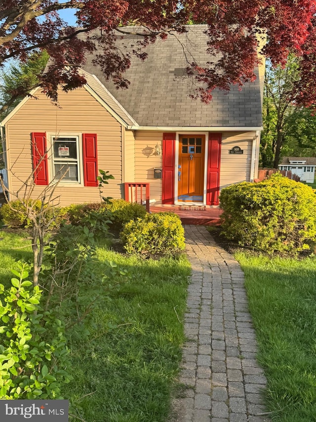 view of front of house featuring roof with shingles