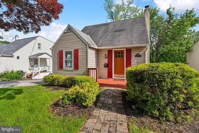 909 Old Lancaster Rd, Berwyn, PA 19312 - view of front facade featuring a chimney and a shingled roof