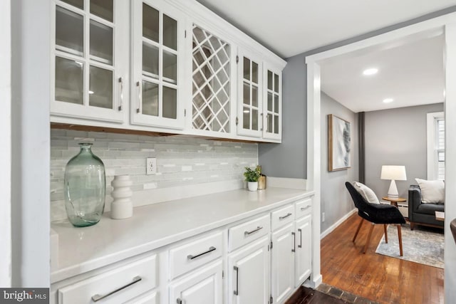 909 Old Lancaster Rd, Berwyn, PA 19312 - bar featuring backsplash, dark wood-style floors, baseboards, and recessed lighting
