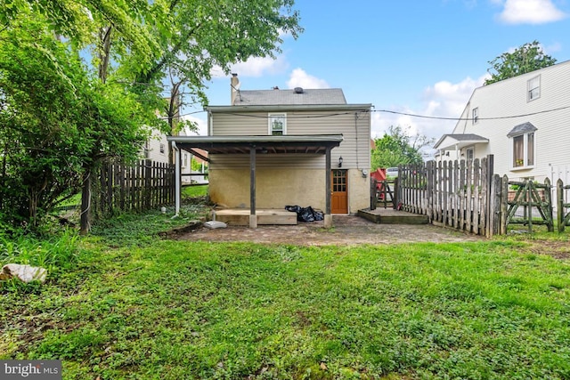 909 Old Lancaster Rd, Berwyn, PA 19312 - rear view of house with a chimney