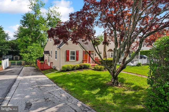 909 Old Lancaster Rd, Berwyn, PA 19312 - view of property hidden behind natural elements with concrete driveway and a front yard