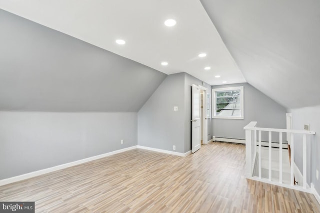 909 Old Lancaster Rd, Berwyn, PA 19312 - bonus room featuring light wood-style floors, baseboards, lofted ceiling, recessed lighting, and a baseboard radiator
