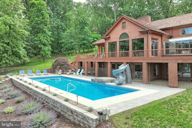 174 Springhouse Ln, Spring Grove, PA 17362 - view of swimming pool featuring a water slide, a patio, and a deck