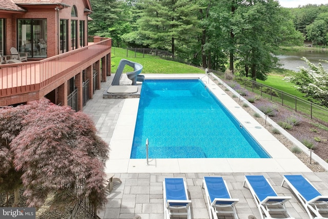 174 Springhouse Ln, Spring Grove, PA 17362 - view of swimming pool with a water slide, a wooden deck, and a patio area