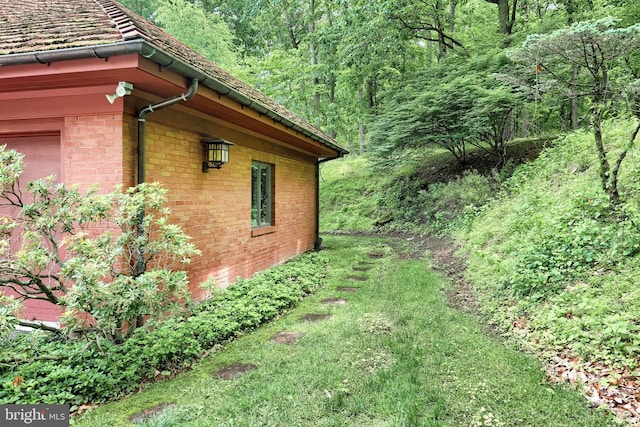174 Springhouse Ln, Spring Grove, PA 17362 - view of side of home with brick siding and a wooded view