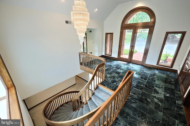 174 Springhouse Ln, Spring Grove, PA 17362 - foyer entrance featuring french doors, a chandelier, vaulted ceiling, marble finish floors, and recessed lighting