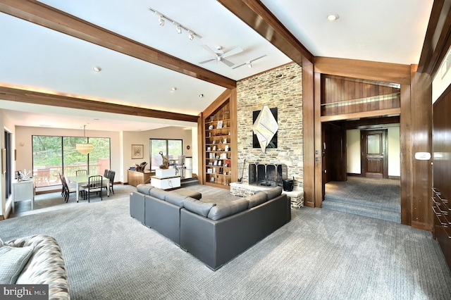 174 Springhouse Ln, Spring Grove, PA 17362 - carpeted living area featuring built in features, ceiling fan, rail lighting, a fireplace, and baseboards