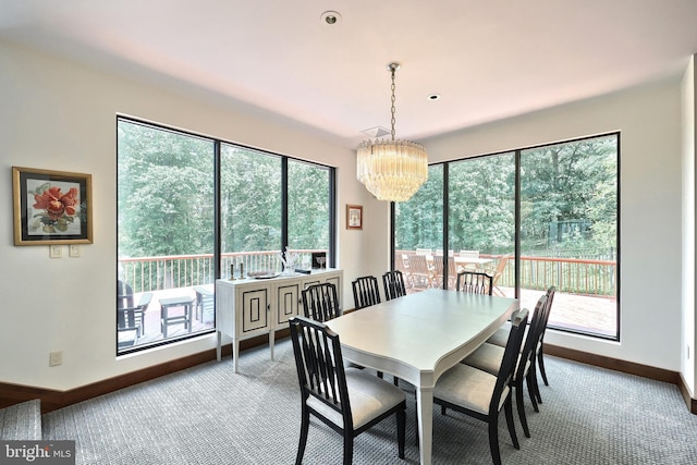 174 Springhouse Ln, Spring Grove, PA 17362 - carpeted dining space featuring baseboards and a chandelier