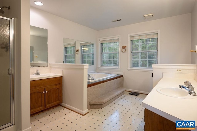 full bathroom with vanity, visible vents, baseboards, tile patterned floors, and a shower stall