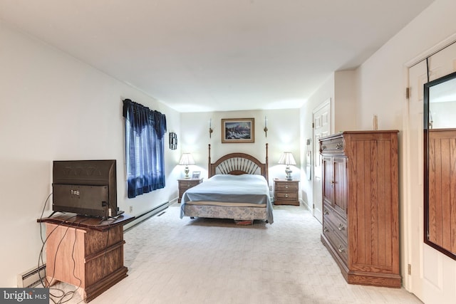 bedroom featuring light carpet and a baseboard radiator