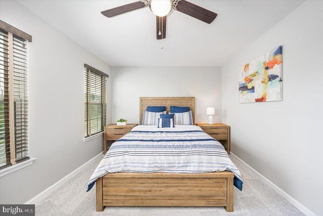bedroom with carpet floors, baseboards, and ceiling fan