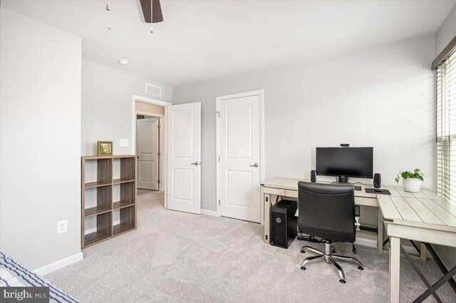 home office featuring carpet floors, a ceiling fan, baseboards, and visible vents