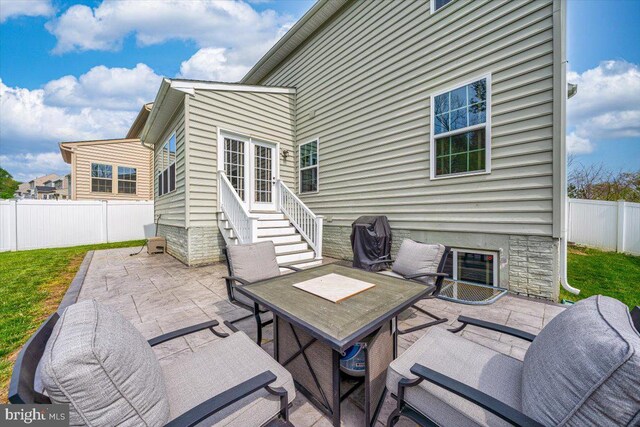 view of patio / terrace with entry steps and a fenced backyard