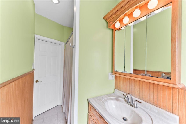 full bathroom featuring tile patterned floors, curtained shower, and vanity