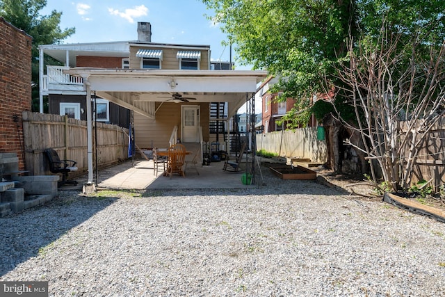 662 Linden Ave, York, PA 17404 - rear view of house with ceiling fan, a fenced backyard, a patio, and a chimney